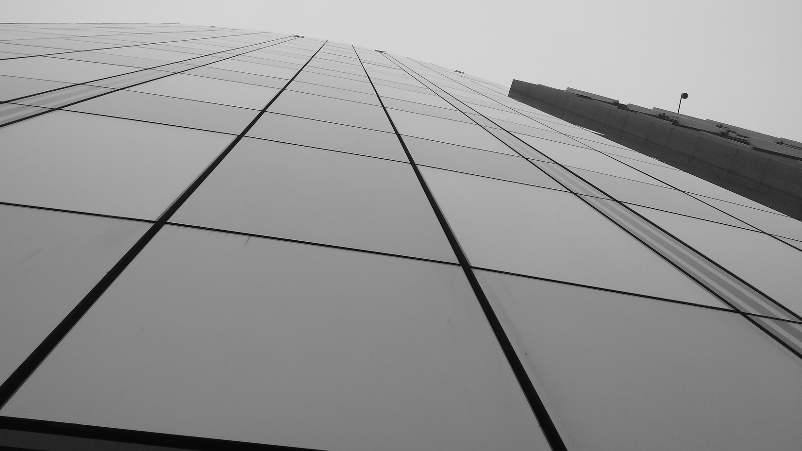 Grayscale Photo of Curtain Wall Building